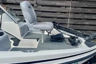 Slide: The Image of 2008 Stratos 476 Ski-N-Fish boat with gray seating and trolling motor. - 14