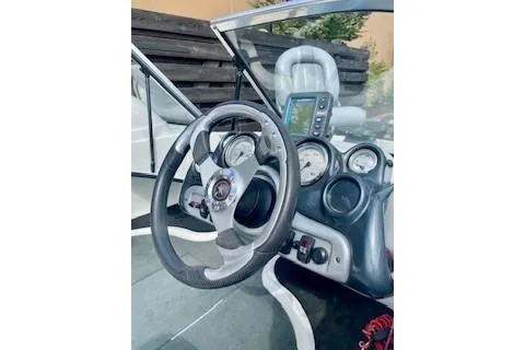 Slide: The Image of 2008 Stratos 476 Ski-N-Fish boat dashboard with steering wheel and gauges. - 15