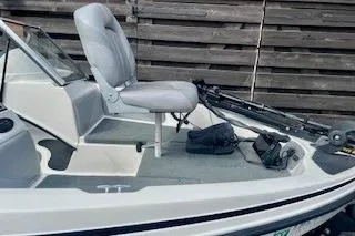 Slide: The Image of 2008 Stratos 476 Ski-N-Fish boat with seating and fishing equipment. - 3