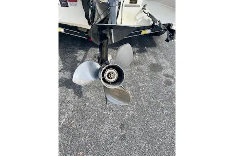 Slide: The Image of 2008 Stratos 476 Ski-N-Fish boat propeller on asphalt surface. - 9