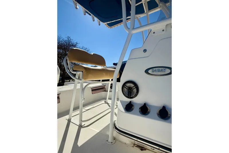 Slide: The Image of 2018 Epic 24 Bay Center Console boat interior with seating and control panel. - 10