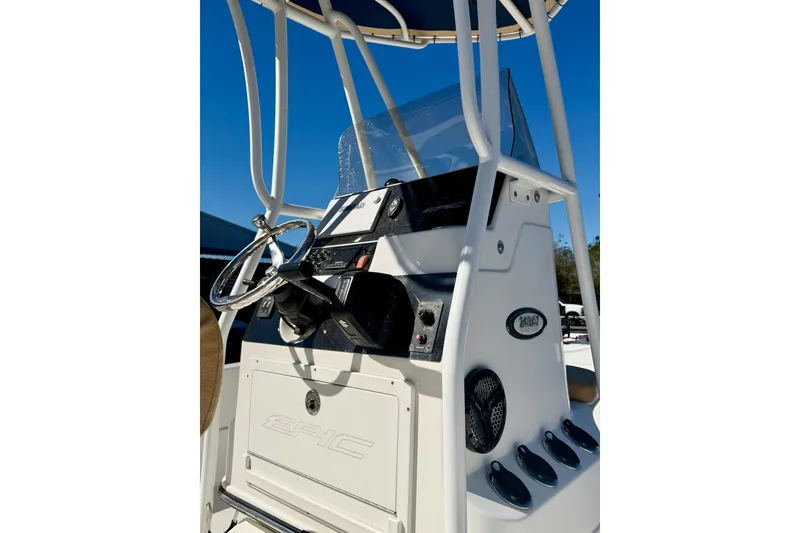 Slide: The Image of 2018 Epic 24 Bay Center Console boat dashboard with steering wheel and controls. - 13