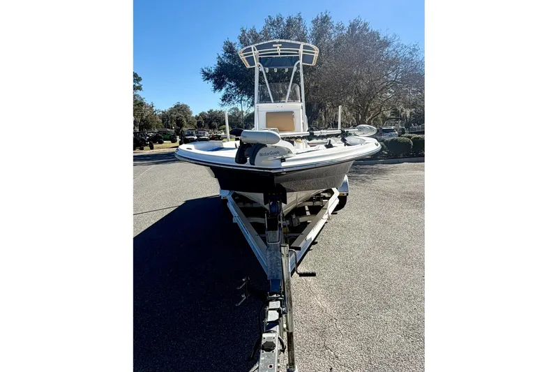 Slide: The Image of 2018 Epic 24 Bay Center Console boat on trailer, parked outdoors. - 2