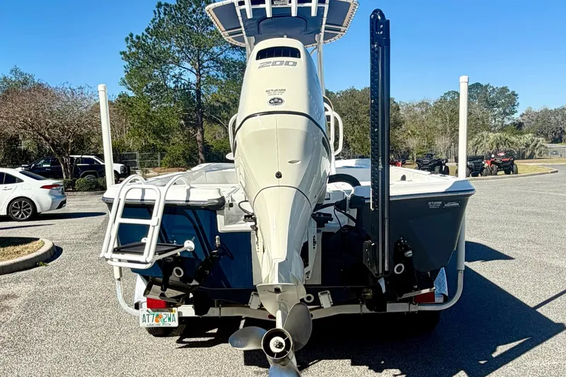 Slide: The Image of 2018 Epic 24 Bay Center Console boat with powerful outboard motor in parking lot. - 6