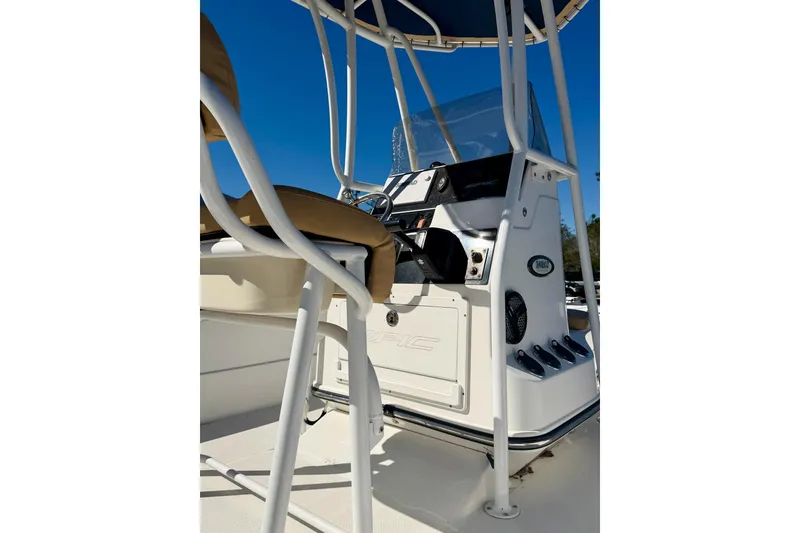 Slide: The Image of 2018 Epic 24 Bay Center Console boat interior with steering wheel and seating. - 8