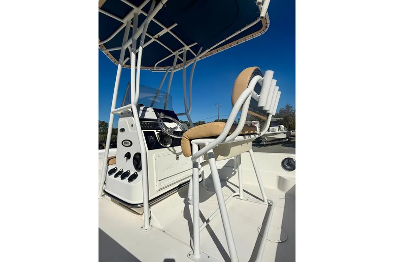 Slide: The Image of 2018 Epic 24 Bay Center Console boat interior with steering wheel and seating. - 9