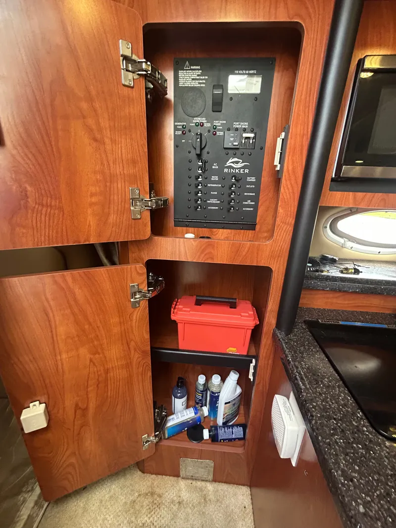 Slide: The Image of Interior of 2013 Rinker 290 Express Cruiser with control panel. - 14