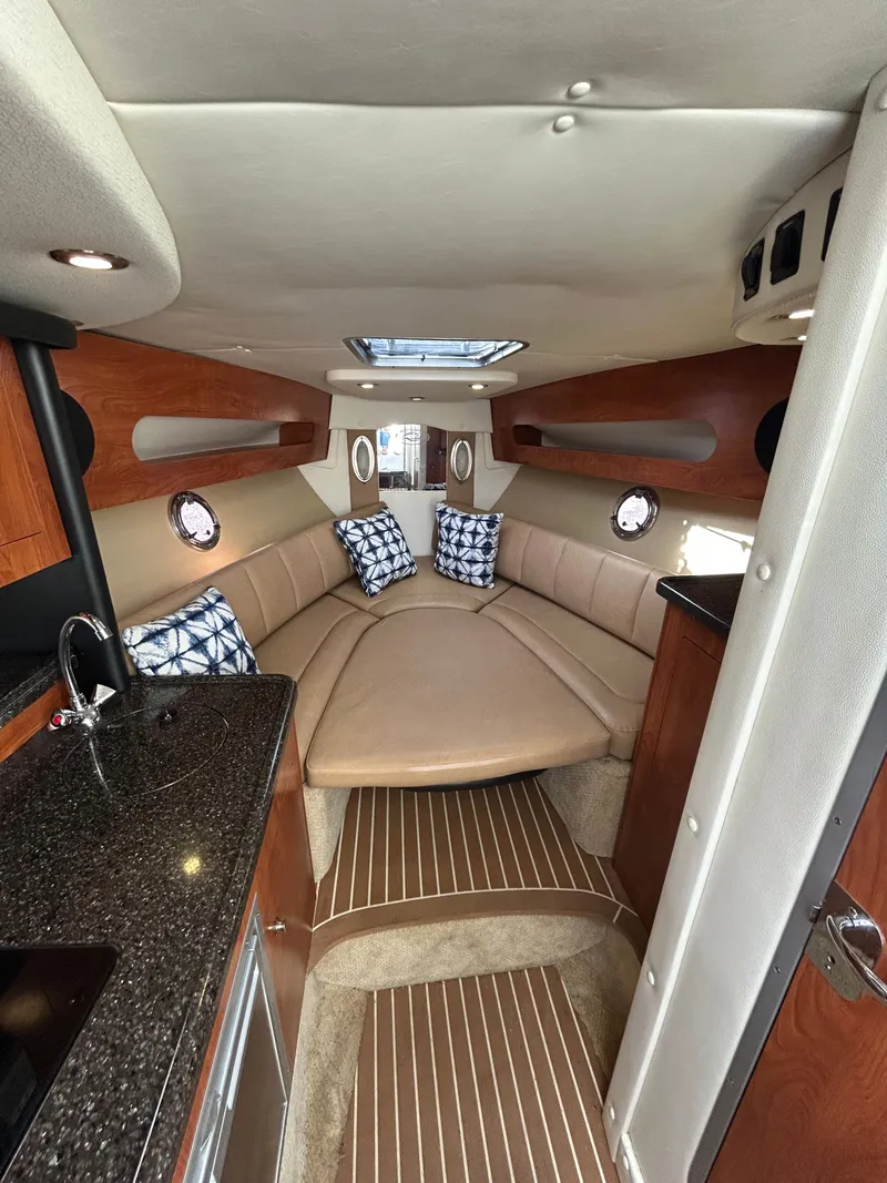 Slide: The Image of Interior of 2013 Rinker 290 Express Cruiser with cozy cabin. - 23