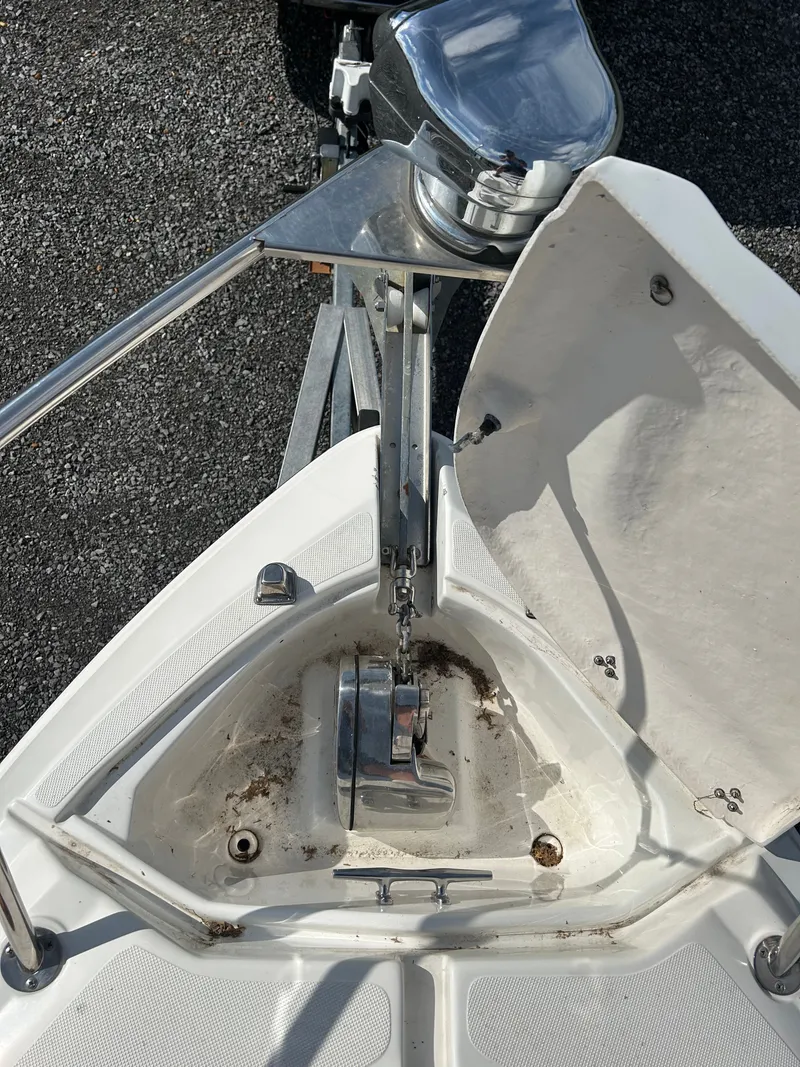 Slide: The Image of Anchor windlass of a 2013 Rinker 290 Express Cruiser boat. - 25