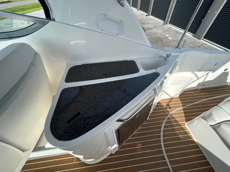 Slide: The Image of Interior of 2013 Rinker 290 Express Cruiser with seating and countertop. - 31