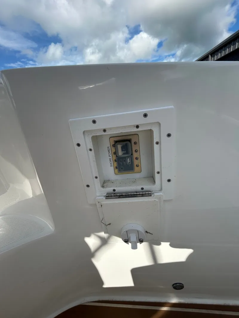 Slide: The Image of Rinker 290 Express Cruiser 2013 control panel under blue sky. - 35