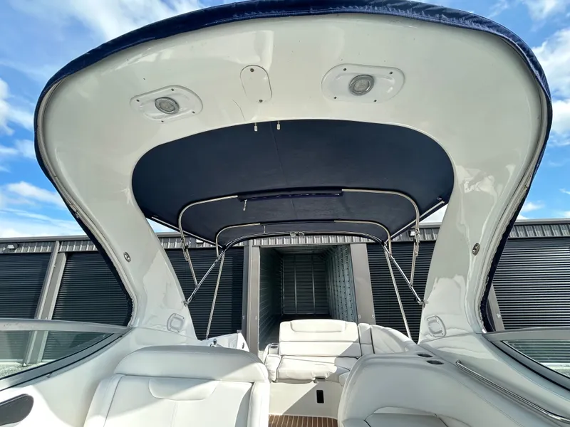 Slide: The Image of Interior view of a 2013 Rinker 290 Express Cruiser boat. - 38