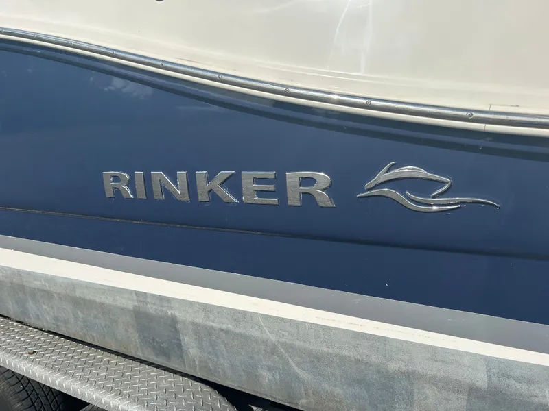 Slide: The Image of Rinker 290 Express Cruiser 2013 boat, blue and white paint. - 4