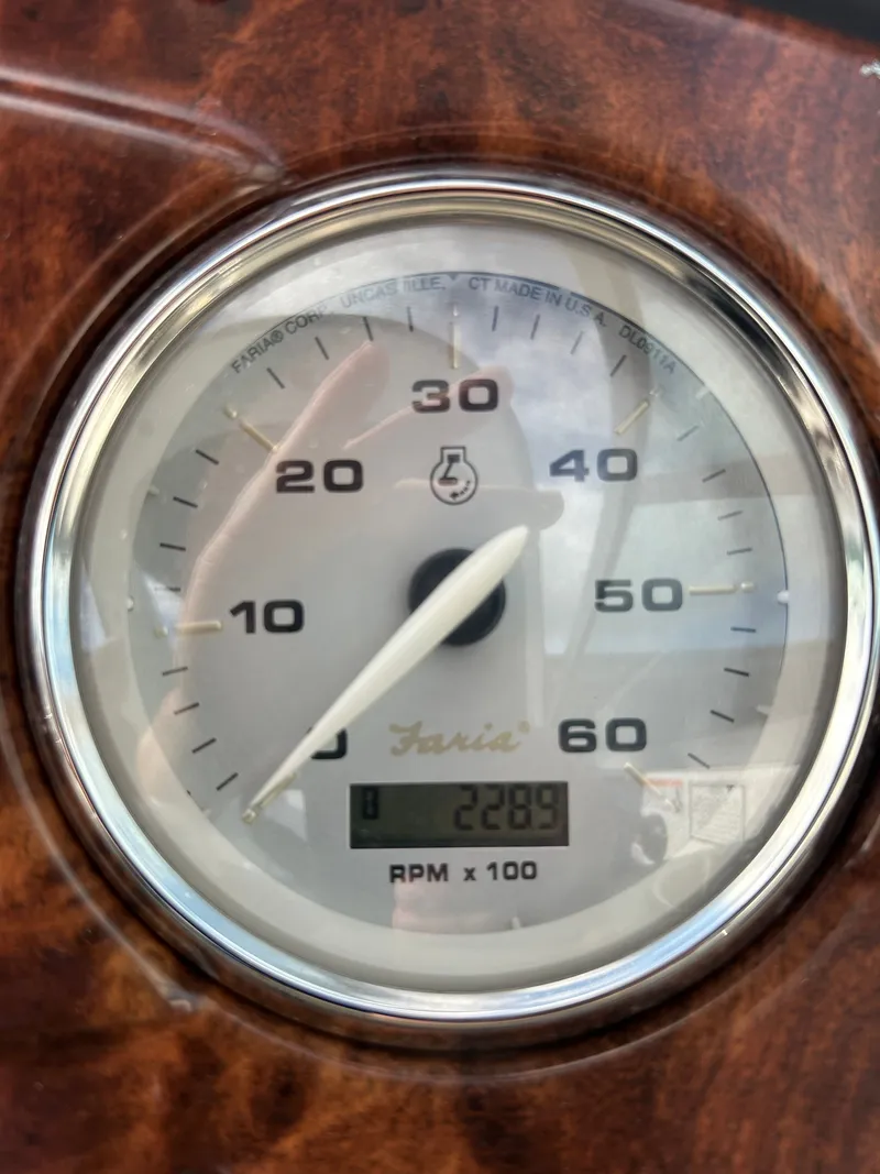 Slide: The Image of Tachometer of a 2013 Rinker 290 Express Cruiser, displaying 2289 RPM. - 46