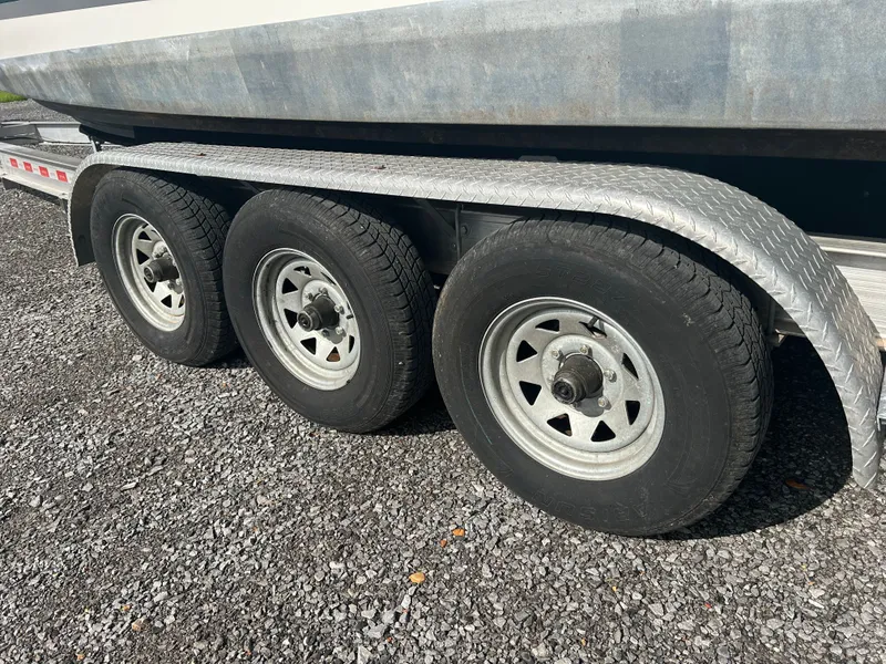 Slide: The Image of Triple-axle boat trailer for 2013 Rinker 290 Express Cruiser. - 5