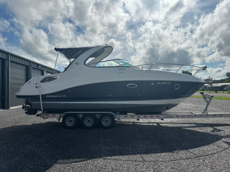 Slide: The Image of 2013 Rinker 290 Express Cruiser on trailer, side view. - 6