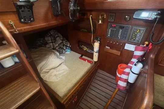 Slide: The Image of Cozy cabin interior of a 1980 Shannon 28 sailboat with navigation equipment. - 10