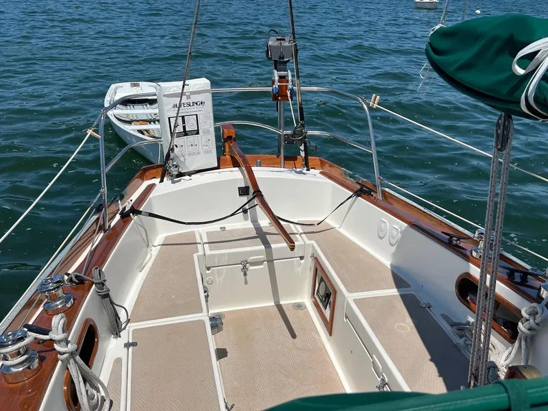 Slide: The Image of Cockpit of a 1980 Shannon 28 sailboat on calm water. - 16