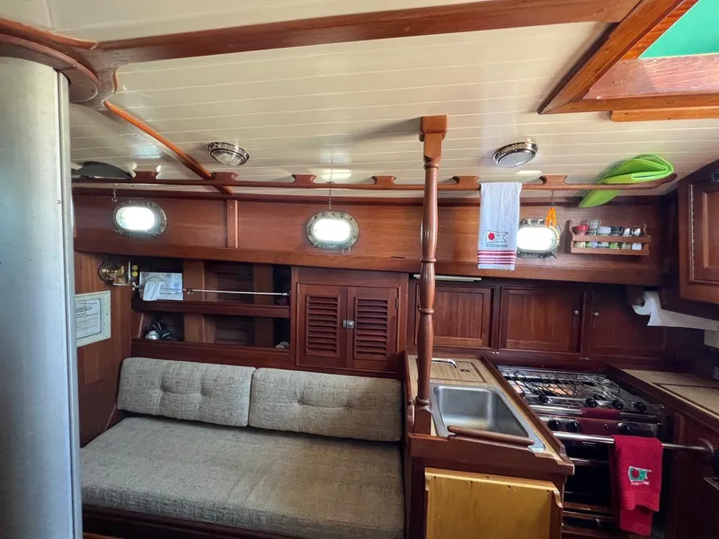 Slide: The Image of Interior of a 1980 Shannon 28 sailboat with wooden furnishings. - 5