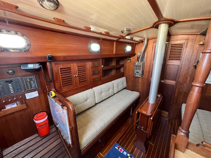Slide: The Image of Interior of a 1980 Shannon 28 yacht with wooden furnishings. - 9