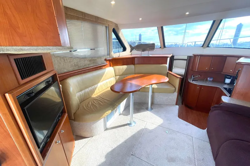 Slide: The Image of FORWARD TO PORT DINETTE AREA W/WOOD FINISHED TABLE - 7