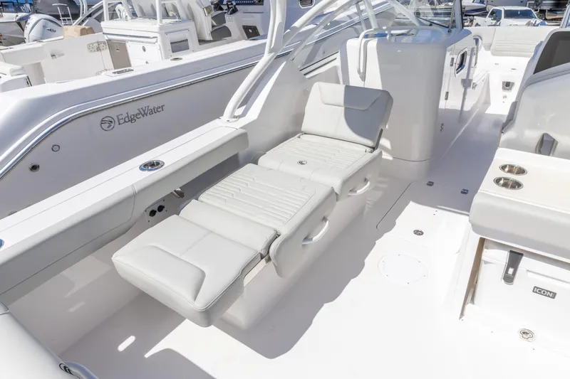 Slide: The Image of 2026 Edgewater 248CX Crossover boat interior with luxurious seating and modern design. - 10