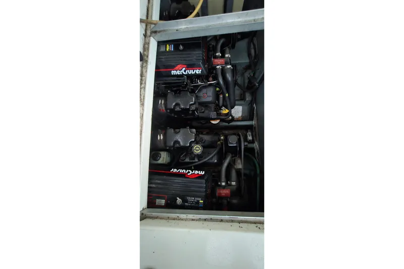 Slide: The Image of Engine compartment of a 1996 Sea Ray 290 Sundancer with MerCruiser engines. - 7