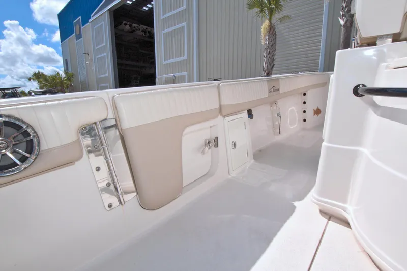 Slide: The Image of 2018 Sea Chaser 27 HFC boat interior, featuring storage compartments and sleek design. - 14