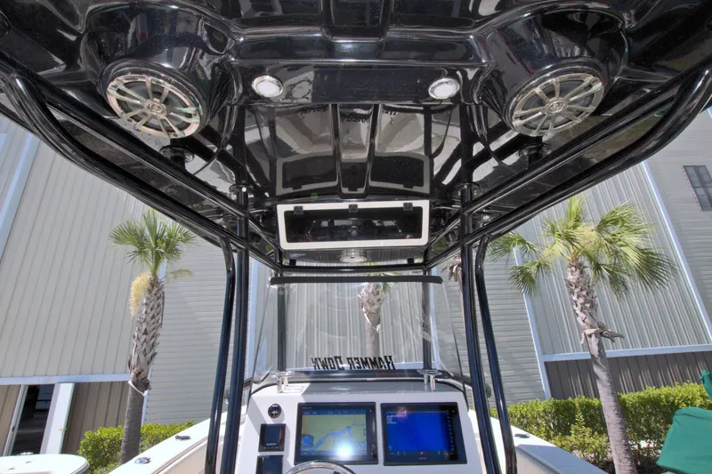 Slide: The Image of 2018 Sea Chaser 27 HFC boat interior with speakers and navigation screens. - 20