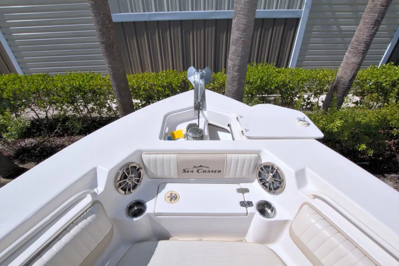 Slide: The Image of 2018 Sea Chaser 27 HFC boat interior with seating and storage compartments. - 25