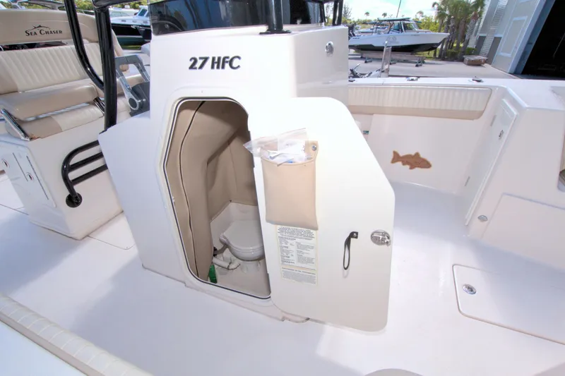 Slide: The Image of 2018 Sea Chaser 27 HFC boat interior with open storage compartment. - 29