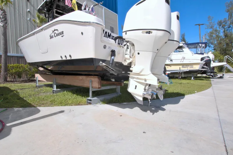 Slide: The Image of 2018 Sea Chaser 27 HFC boat on display with dual outboard motors. - 4