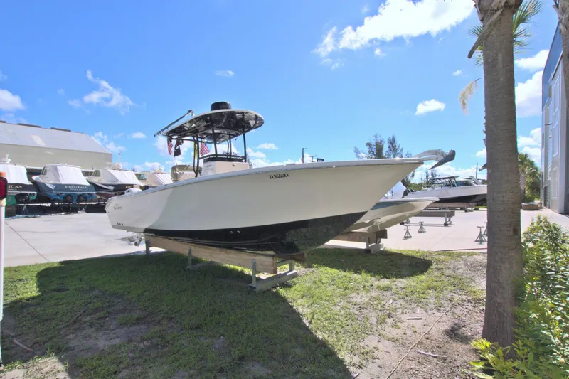 Slide: The Image of 2018 Sea Chaser 27 HFC boat on display outdoors under a clear blue sky. - 46