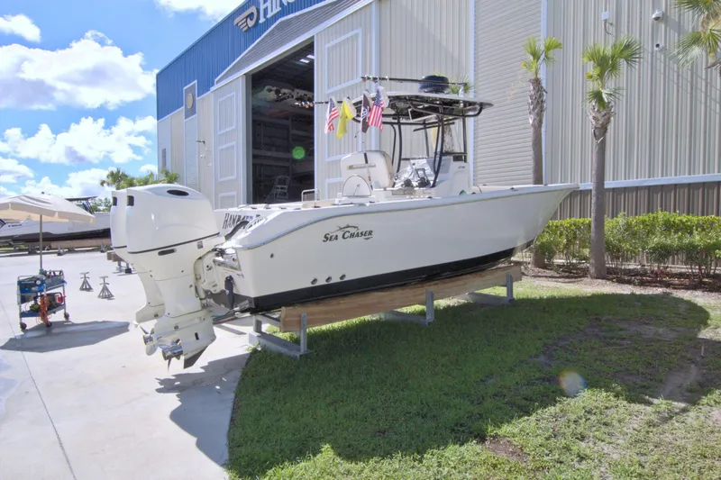 Slide: The Image of 2018 Sea Chaser 27 HFC boat on display outside a large storage facility. - 6