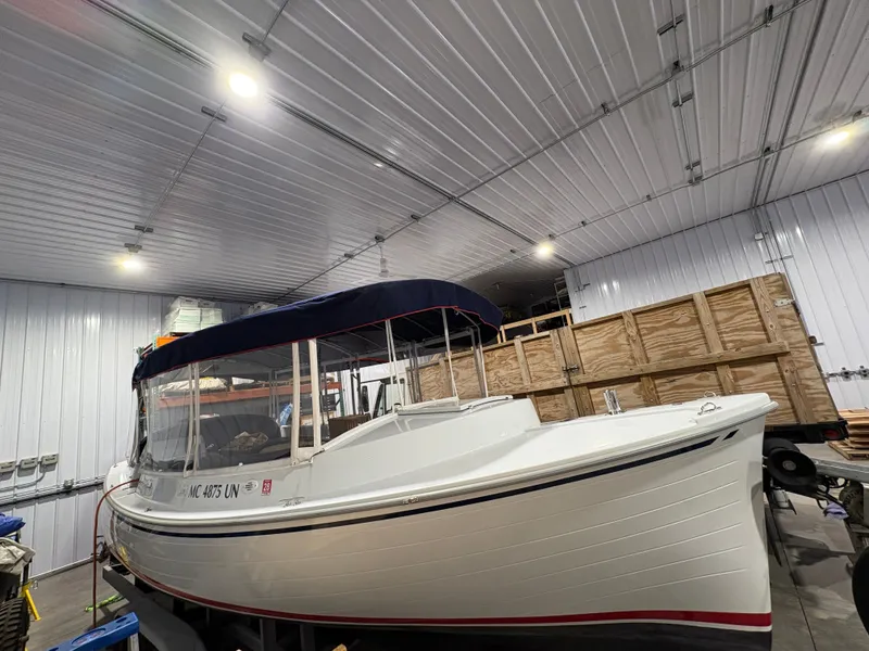 Slide: The Image of 2021 Duffy Cuddy Cabin boat in storage facility. - 15