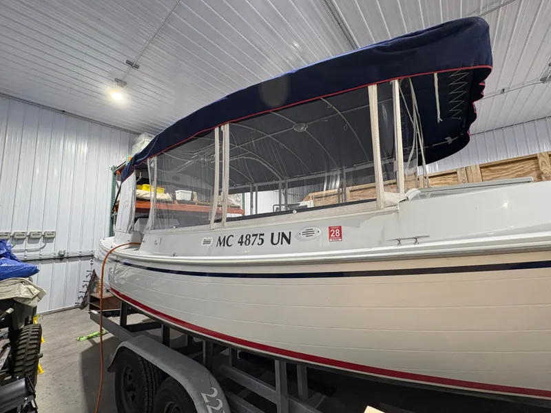 Slide: The Image of 2021 Duffy Cuddy Cabin boat in storage facility. - 16