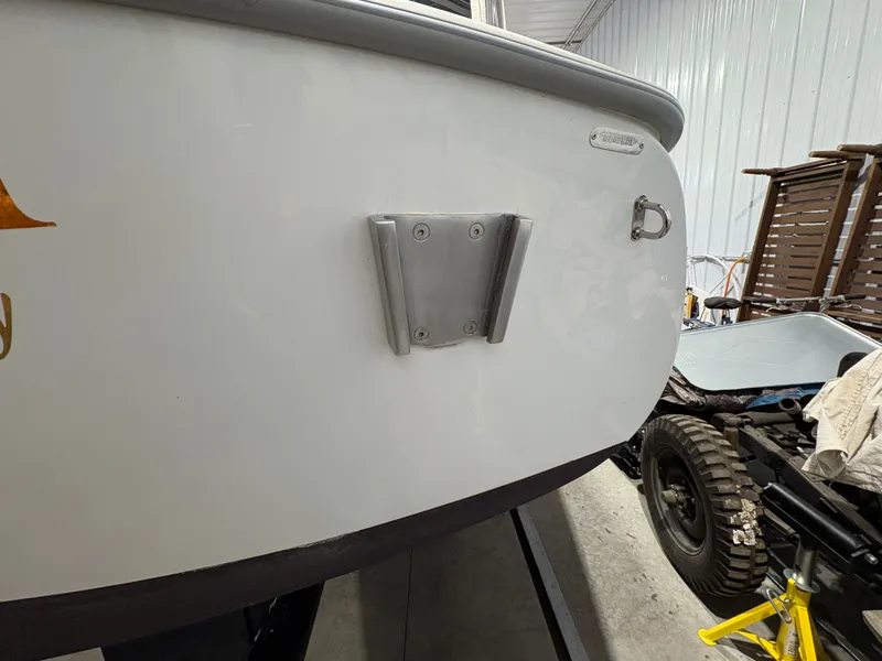 Slide: The Image of Stern of a 2021 Duffy Cuddy Cabin boat in a workshop. - 19