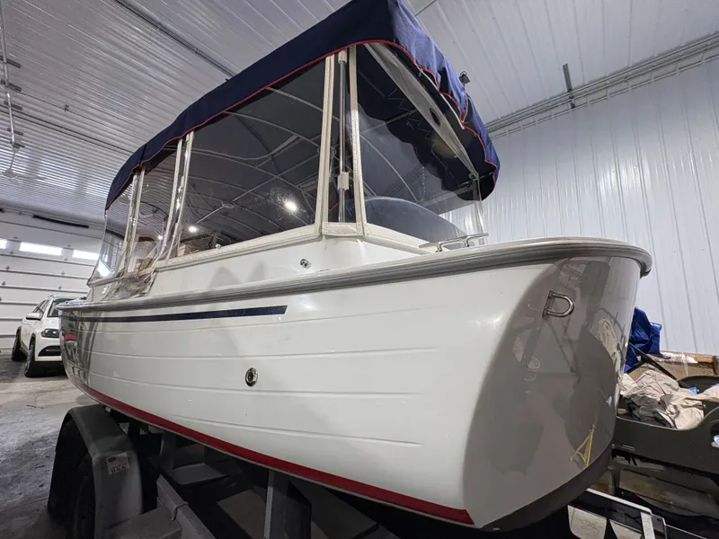 Slide: The Image of 2021 Duffy Cuddy Cabin boat in a garage. - 21