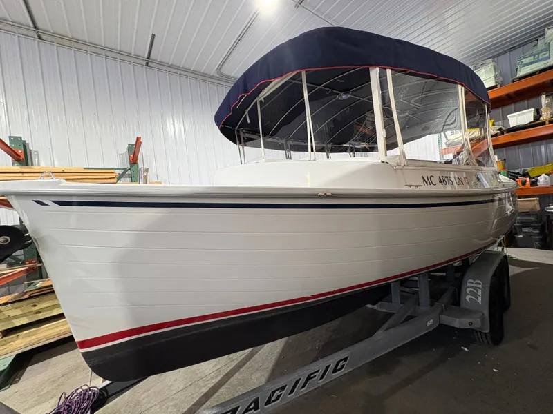 Slide: The Image of 2021 Duffy Cuddy Cabin boat in warehouse on trailer. - 23