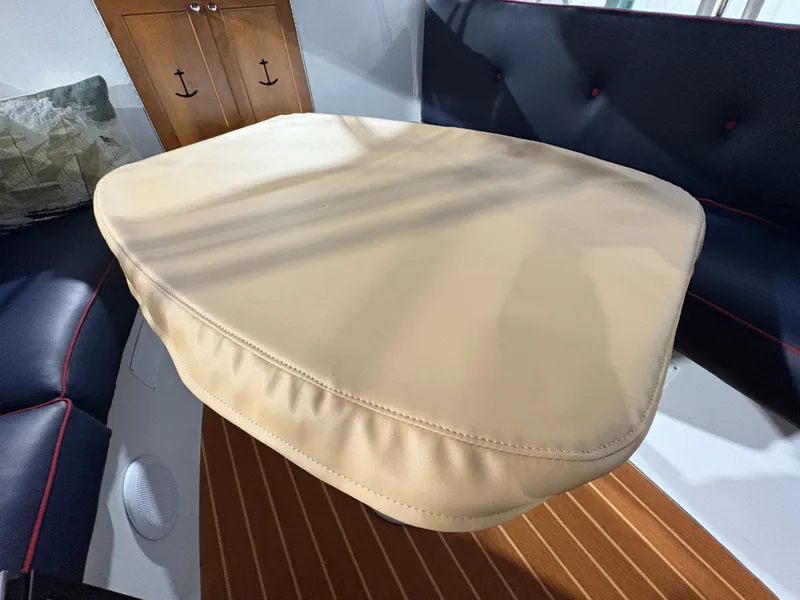 Slide: The Image of Interior of 2021 Duffy Cuddy Cabin with cushioned table. - 25