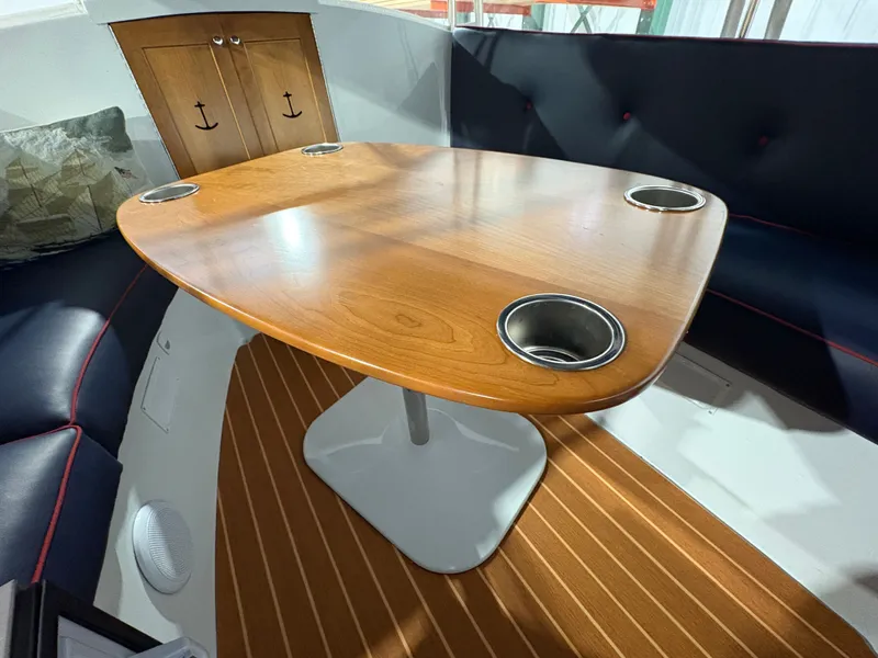 Slide: The Image of Interior of a 2021 Duffy Cuddy Cabin with wooden table and seating area. - 26