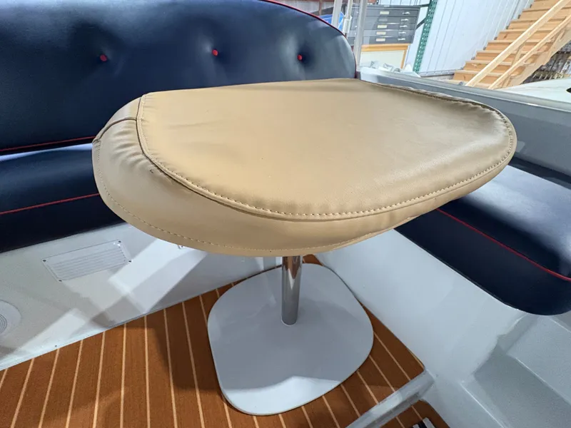 Slide: The Image of Interior of a 2021 Duffy Cuddy Cabin with cushioned seating. - 27