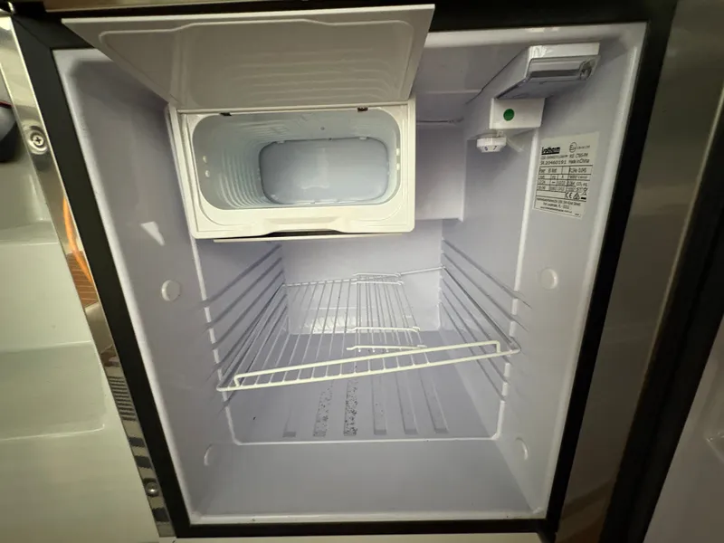 Slide: The Image of Empty refrigerator in a 2021 Duffy Cuddy Cabin. - 29