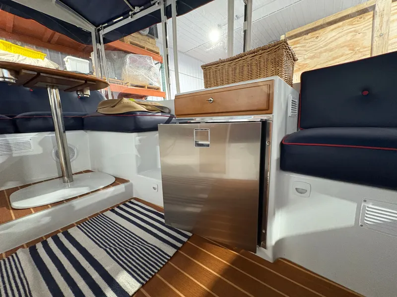 Slide: The Image of Interior of a 2021 Duffy Cuddy Cabin with table and fridge. - 38