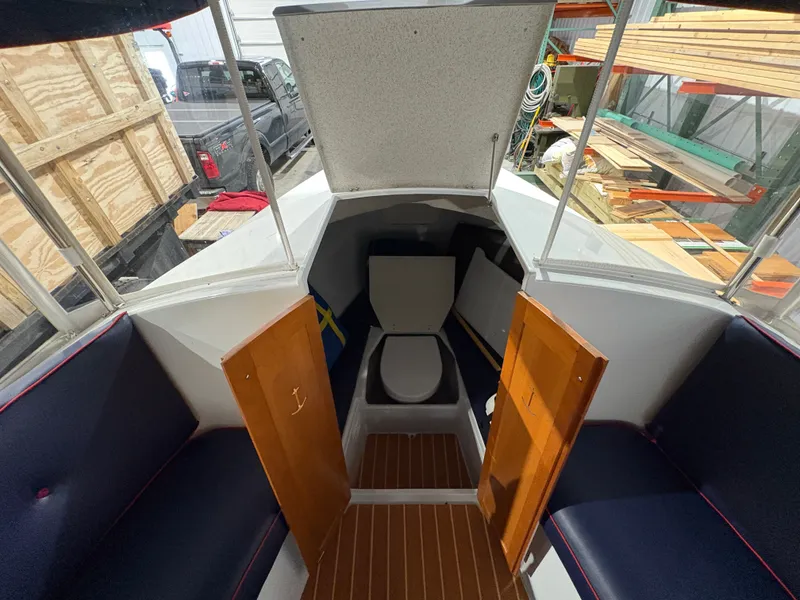 Slide: The Image of Interior of a 2021 Duffy Cuddy Cabin with seating and toilet. - 43