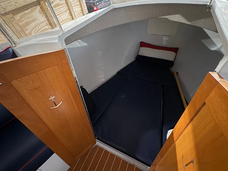 Slide: The Image of Interior of a 2021 Duffy Cuddy Cabin with wooden doors and sleeping area. - 45
