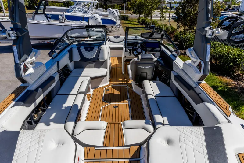 Slide: The Image of 2022 Nautique Super Air Nautique G23 boat interior with luxurious seating and modern design. - 8