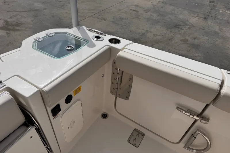 Slide: The Image of 2026 Sailfish 276 DC boat interior with seating and storage compartments. - 10