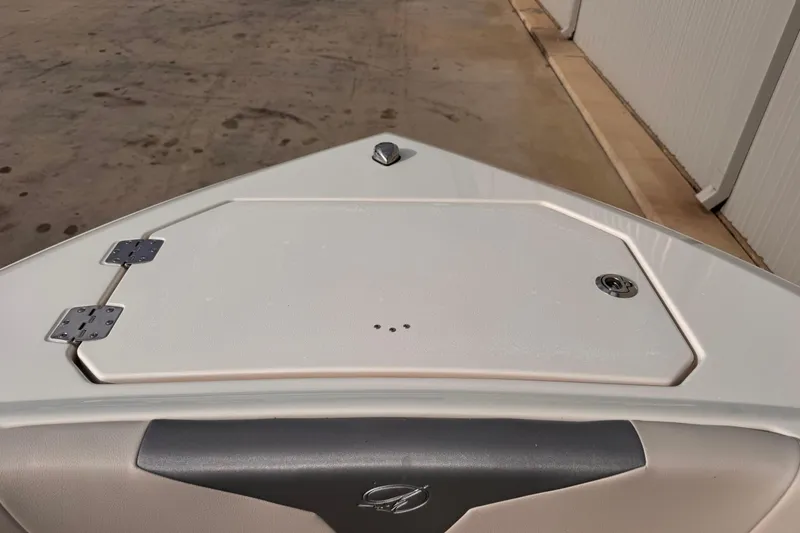Slide: The Image of Bow of 2026 Sailfish 276 DC boat with storage compartment and hinges. - 24