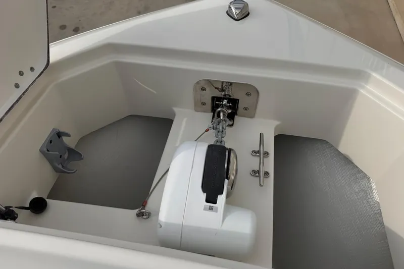 Slide: The Image of Anchor compartment of 2026 Sailfish 276 DC boat, featuring a modern winch system. - 25